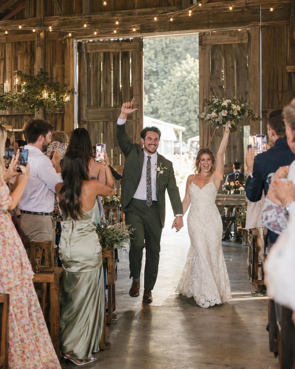 Guests cheering as the couple enters the reception